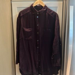 This is a top from Free People.  It has a stylish detail at the cuff.  Plum XL